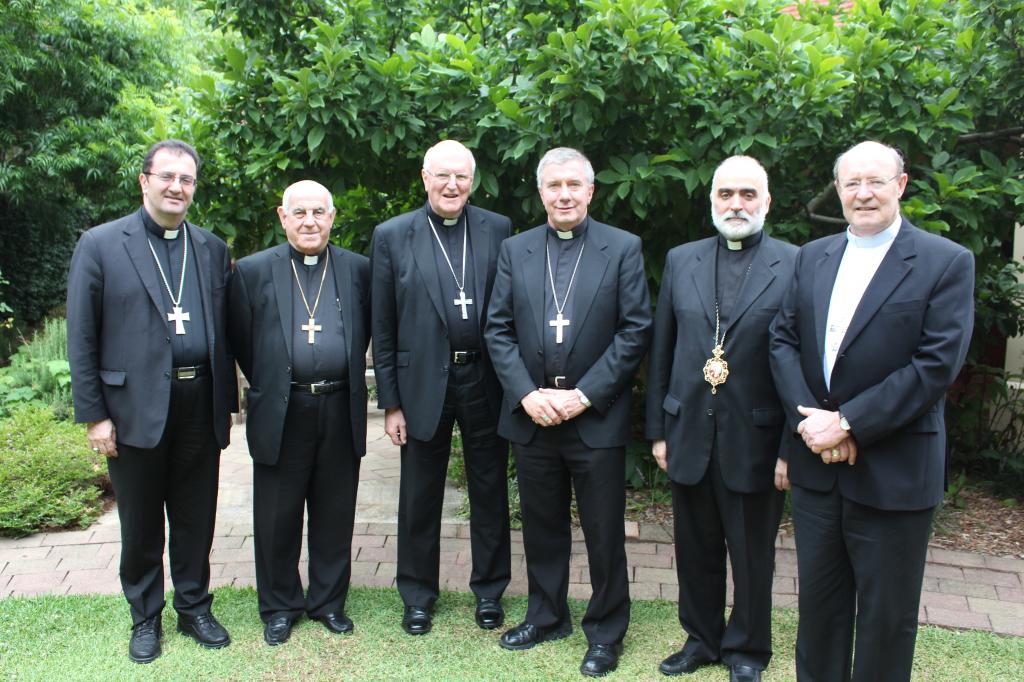 Delegation of Australian Catholic Bishops to visit refugees in Iraq and Lebanon. Pictured with President of the Australian Catholic Bishops Conference Archbishop Denis Hart during plenary meeting in Mary MacKillop Place, Sydney. The delegation comprises (l-r) the Maronite Archbishop Antoine-Charbel Tarabay, the Chaldean Archbishop Jibrael Kassab, Archbishop of Canberra and Goulburn Christopher Prowse, the Melkite Archbishop Robert Rabbat and the Archbishop of Hobart Julian Porteous. PHOTO: Aoife Connors