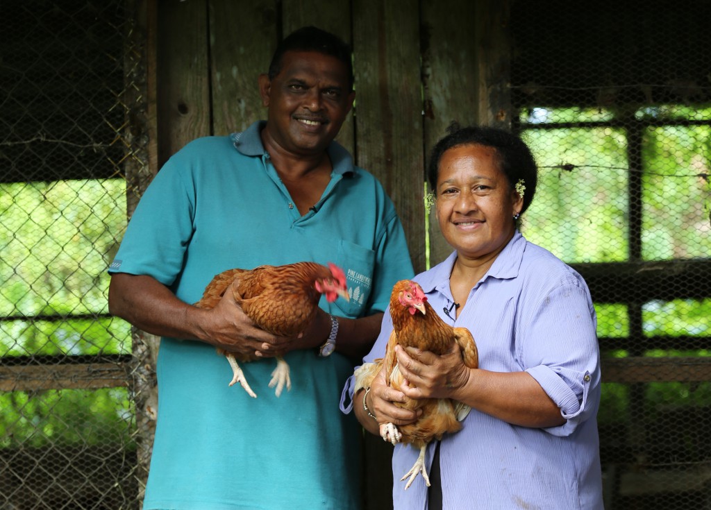 Eric and Ma, married couple who own a farm in Fiji, outside their chicken coop. PHOTO: Andrew Garrick & Drew Morrison