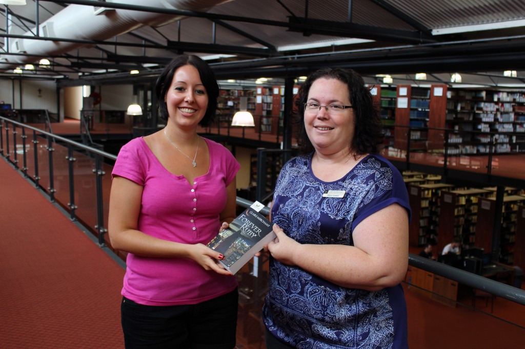 Notre Dame graduate, Claire Merchant, with Alison Gowers, Application Administrator and Copyright Officer for the St Teresa’s Library, Fremantle. Claire has just released her third novel titled Forever Ruby. PHOTO: UNDA