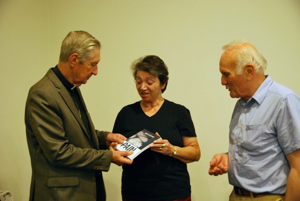 Emeritus Archbishop Barry James Hickey, author of Hidden Pain Anne Lastman and State President of Australian Family Association John Barich discuss Lastman's latest book at this week's book launch. PHOTO: Marco Ceccarelli