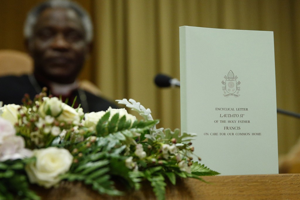 The English edition of Pope Francis' encyclical on the environment is pictured during a news conference at the Vatican June 18. The encyclical is titled, "Laudato Si', on Care for Our Common Home. PHOTO: CNS/Paul Haring