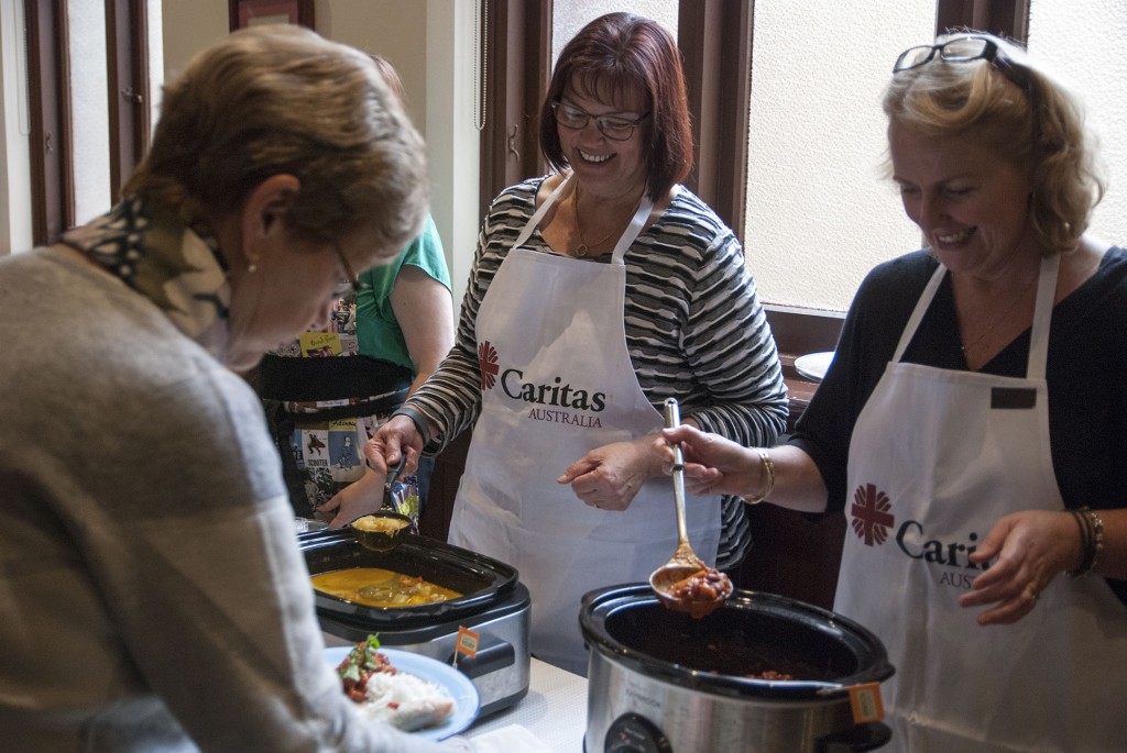 Caritas staff members Janeen Murphy and Kerry Troost serve guests at the Project Compassion Thank You Lunch held on Wednesday 22 July at the Catholic Pastoral Centre, Highgate. PHOTO: Marco Ceccarelli