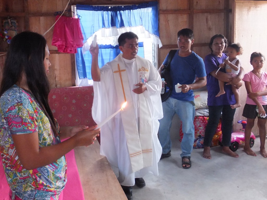 Perth-based mission organisation Buckets for Jesus co-ordinated a new housing project in the Phillipines for those affected by Typhoon Yolanda. A local priest is seen here blessing the new homes. PHOTO: Michael Soh