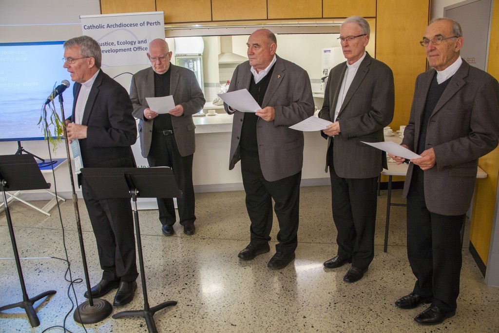 Archbishop Timothy Costelloe, front left, joined by fellow WA Bishops, from left, Bishop Gerard Holohan of Bunbury, Bishop Christopher Saunders of Broome, Perth Auxiliary Bishop Don Sproxton and Bishop Justin Bianchini of Geraldton. The bishops came together to pray at the Perth launch of the 2015 ACBC Social Justice Statement. PHOTO: Jamie O’Brien