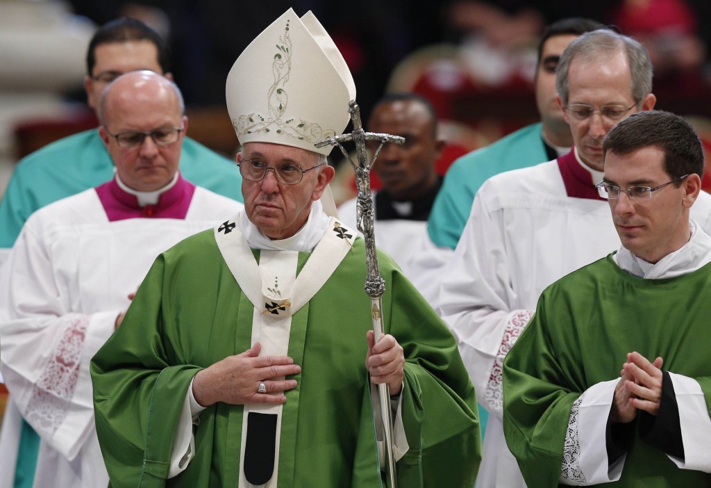 Pope Francis leaves after celebrating the closing Mass of the Synod of Bishops on the family in St Peter's Basilica at the Vatican on 25 October. Photo:CNS/Paul Haring