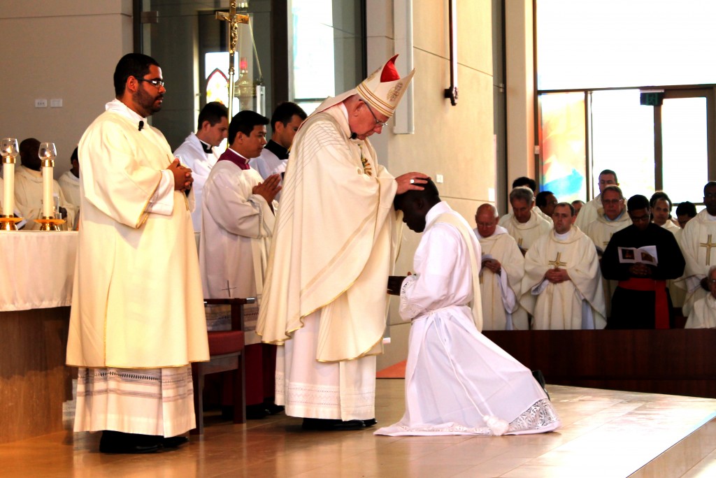 Bishop Gerard Holohan lays his hands on Fr Abraham during his ordination at Bunbury Cathedral on 23 October. Photo: Supplied.