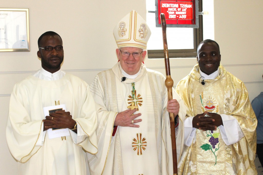 Newly ordained Fr Abraham Chukwu (right), stands besides Bunbury Bishop Gerard Holohan and his brother Deacon Jude Chukwu OSB. Photo: Supplied. 