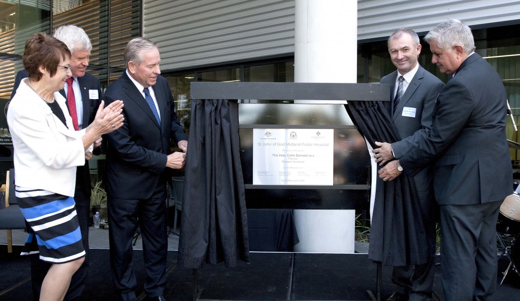 WA Premier Colin Barnett unveils the plaque at the opening of the new St John of God Midland Public Hospital. St John of God Health Care Group Chief Executive Officer, Dr Michael Stanford, stands far left. Photo: Supplied