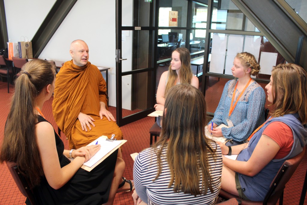 High school students take advantage of the opportunity to speak to Ajahn Brahmali from the Serpentine Buddhist Monastery, who was a special guest of the Cultural DeCoding program. Photo: Supplied