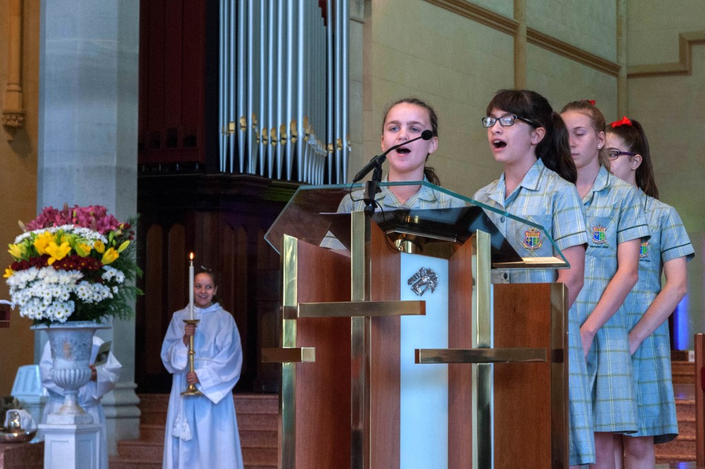 Mercedes College Year 7 students take part in the Mass with their grandparents looking on. Photo: Feby Plando.