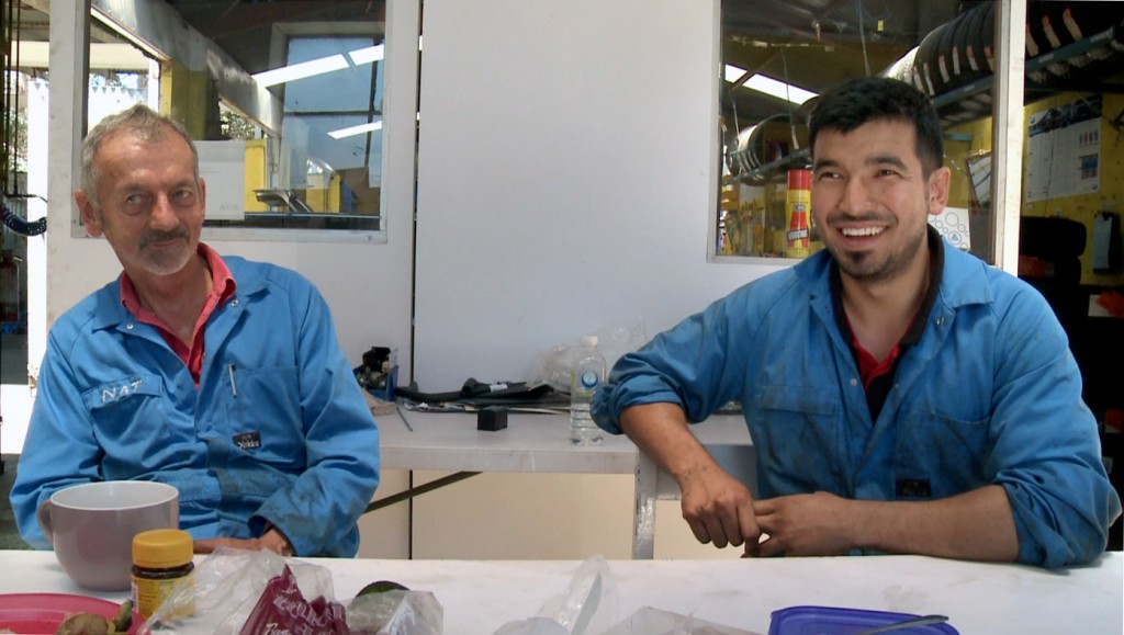 Mechanic Mustafa Jawadi at work with Nat McGahey. Photo: Supplied.