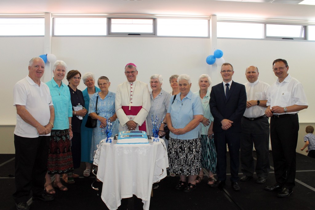 Archbishop Timothy Costelloe (centre) with Our Lady of Lourdes Parish Priest, Fr Stan Bendkowski SDS, (far right), OLOL Primary School Principal Dan Wood, (third from right), Regional Superior of Salvatorians Fr Karol Kulczycki SDS, (second from right) former Parish Priest Fr Laurence Murphy SDS (far left), with sisters from the Sisters of Mercy. Photo: Matthew Gray. 