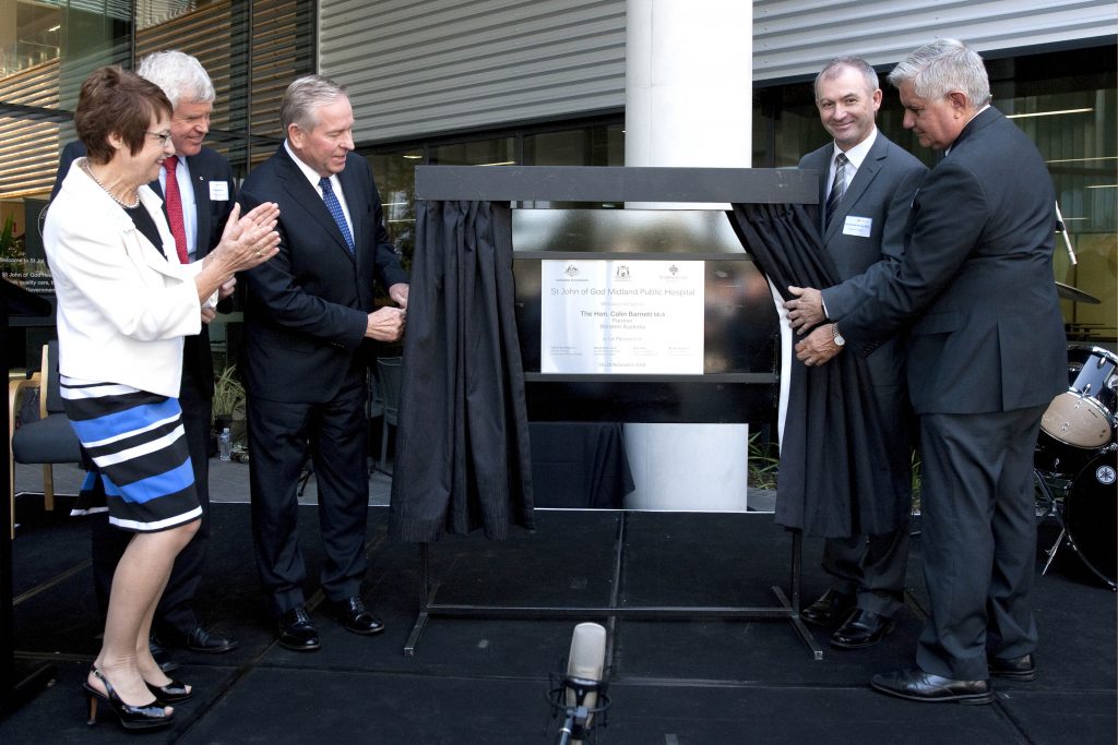 WA Premier Colin Barnett unveils the plaque at the opening of the new St John of God Midland Public Hospital. St John of God Health Care Group chief executive officer Dr Michael Stanford stands far left. Photo: Supplied