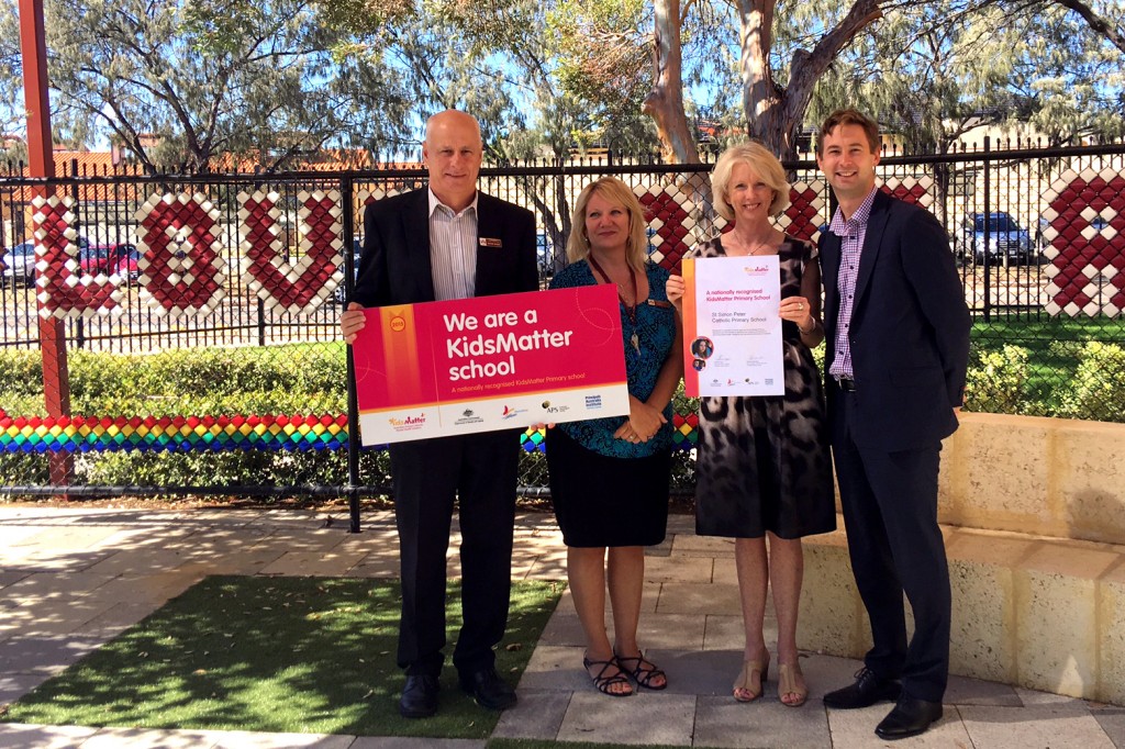 St Simon Peter Catholic Primary School principal Shane Baker, social worker Laura Pope, KidsMatter representative Lynda Cumming and Catholic Education WA Director Edward Simons celebrate the school’s recognition award.