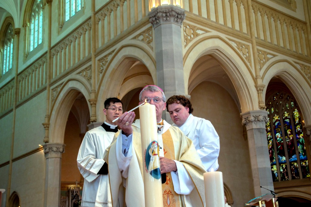 Archbishop Timothy Costelloe lights the new candle for the Jubilee Year of Mercy on 8 December 2015, the Feast of the Immaculate Conception, at St Mary’s Cathedral. Photo: Marco Ceccarelli