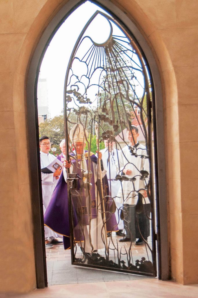 Archbishop Costelloe opens the Holy Door at St Mary’s Cathedral on Saturday, 12 December to mark the commencement of the Jubilee Year of Mercy. Photo: Jamie O’Brien