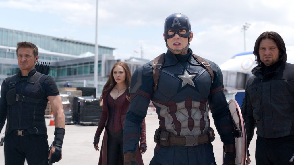 Jeremy Renner, Elizabeth Olsen, Chris Evans and Sebastian Stan star in a scene from the movie Marvel's Captain America: Civil War. Photo: CNS/Disney