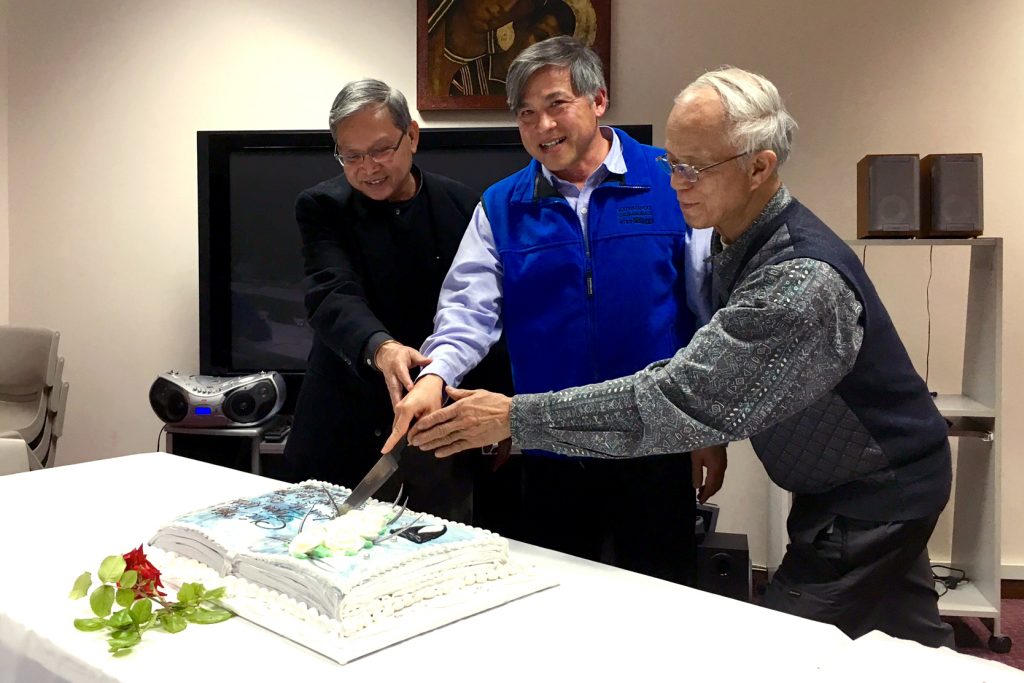 Parish Priest of Our Lady of the Rosary in Doubleview, Fr Peter Nguyen OP, cuts the cake to celebrate the 25th anniversary of his ordination to the priesthood. Photo: Supplied