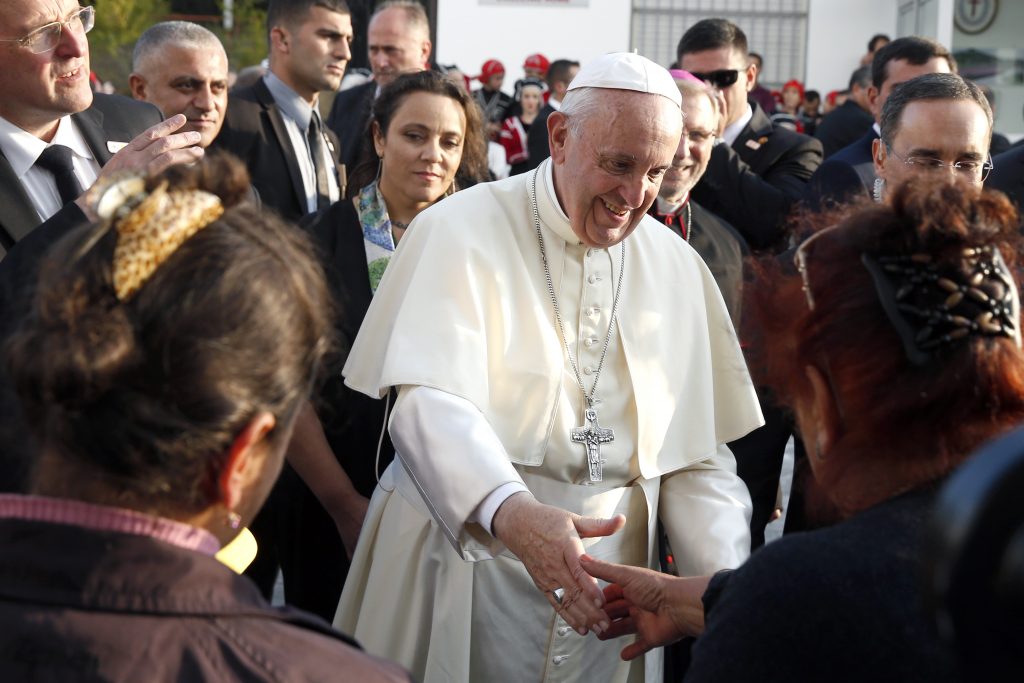 Pope Francis greets people during a meeting with volunteers and people receiving assistance from the Catholic Church near an assistance centre run by the Order of St Camillus in Tbilisi, Georgia on 1 October 2016. Photo: CNS/Paul Haring