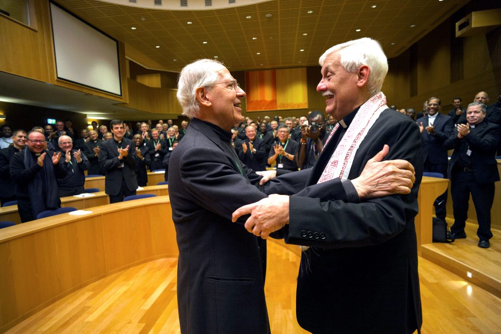 Jesuit Father Arturo Sosa, right, the new superior general of the Society of Jesus, greets the previous superior general, Jesuit Father Adolfo Nicolas, after his election in Rome on 14 October. Father Sosa, 67, is a member of the Jesuits' Venezuelan province. Photo: CNS/Don Doll, S.J