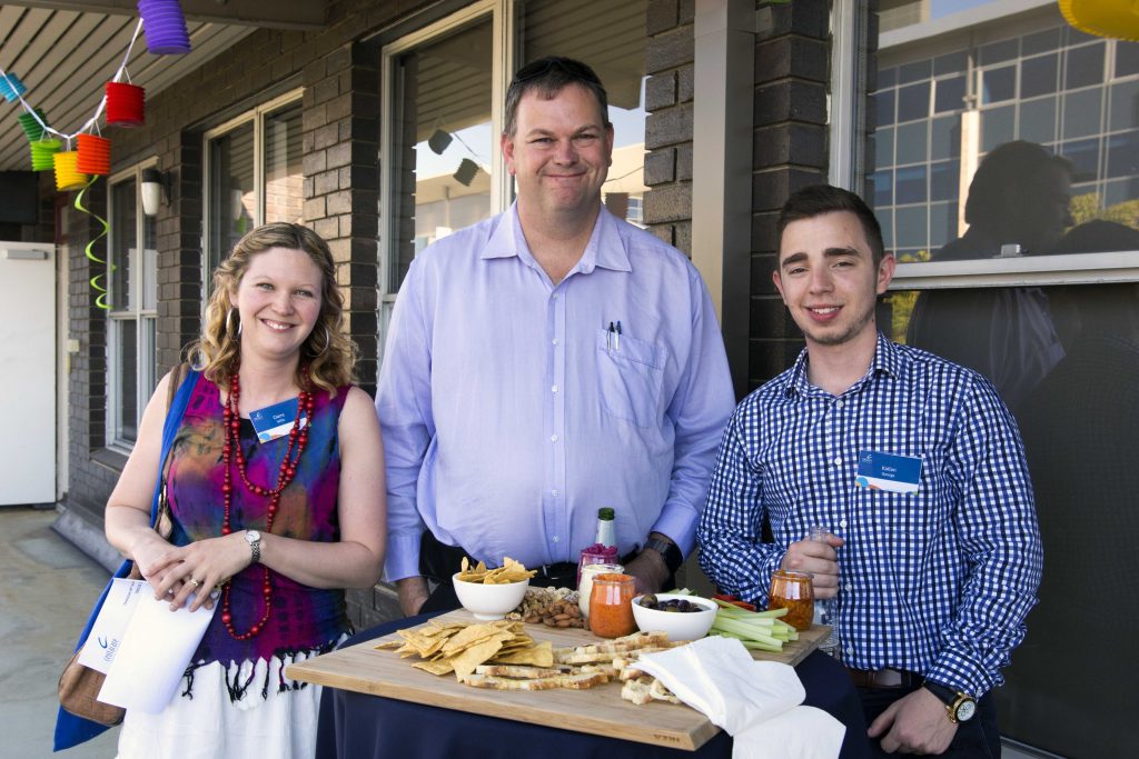 Centacare Employment and Training staff Claire Willis, Doug Bell and Kallan George enjoy the celebrations at their West Perth training centre. Photo: Rachel Curry