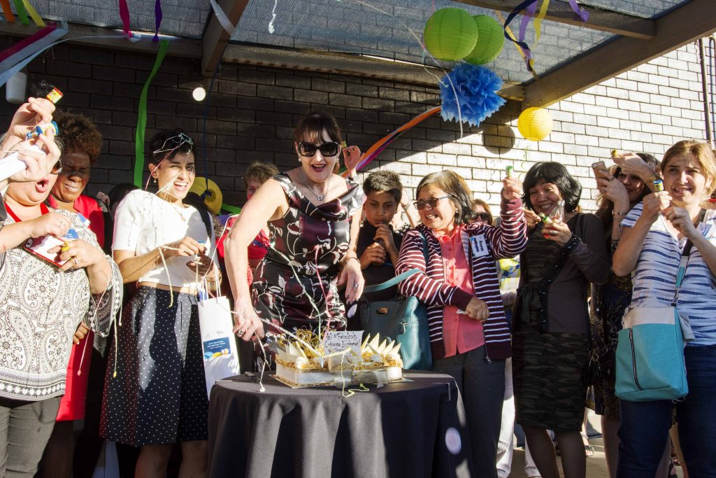 Centacare Employment and Training Executive Director Lee-Anne Phillips cuts the cake to mark the not-for-profit organisation’s 40-year anniversary. Photo: Rachel Curry