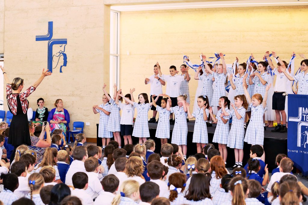 Mother Teresa Catholic College students perform in front of attendees at the official blessing and opening celebration on Wednesday, 2 November. Photo: Supplied