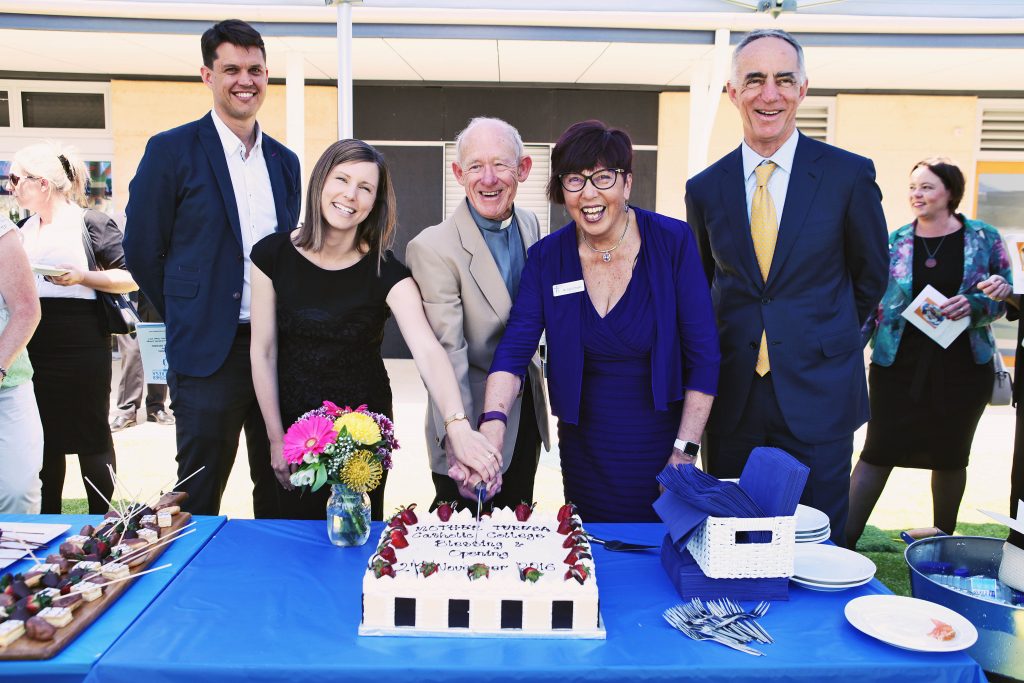 Baldivis Parish Priest Geoff Aldous (third from left) and Mother Teresa Catholic College Principal Geri O’Keefe (second from right) help cut a cake at the official blessing and opening celebration on Wednesday, 2 November. Photo: Supplied