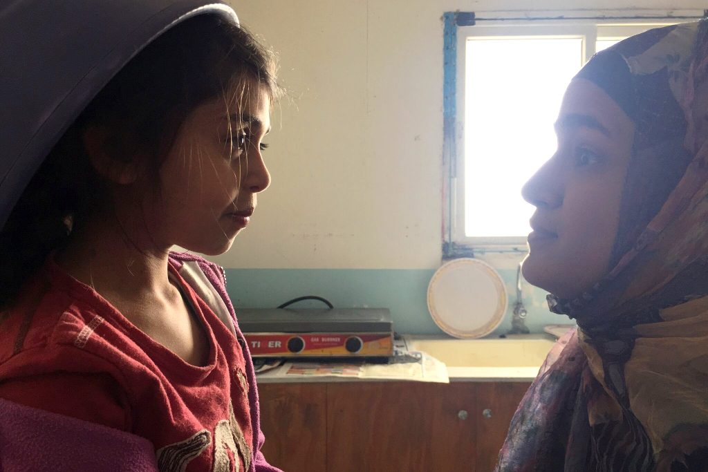 Tasnim (Khadija Al Akel) in conversation with her older sister Layla (Lamis Ammar) in a scene from Sand Storm. Photo: Supplied