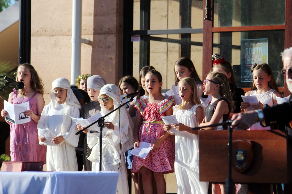 Students from Star of the Sea Catholic Primary School took part in singing and musical performances at an open-air Christmas Eve Mass in the grounds of Kolbe Catholic College in Rockingham. Photo: Supplied