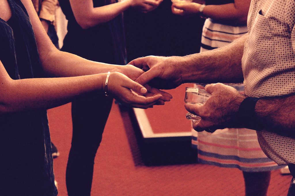 Students had their hands blessed with oil from Jerusalem in a practice that embraces past tradition where the hands of kings, priests and prophets were anointed with oils. Photo: Supplied