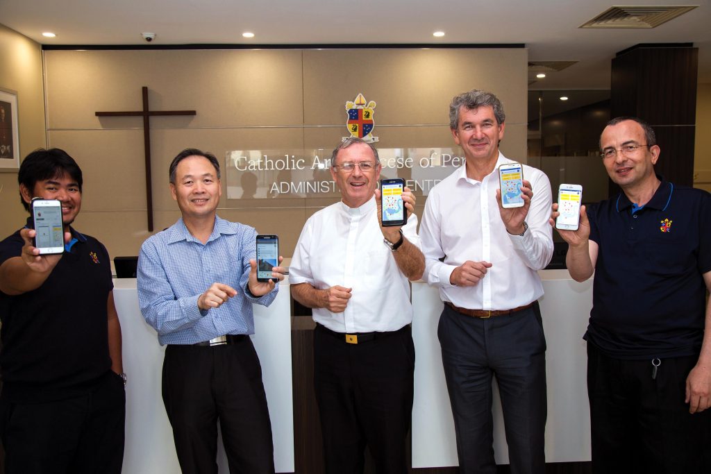 The Archdiocese of Perth has this week launched a new mobile app. Holding their phones are Vicar for Effective Communications the Most Rev Fr Peter Whitely VG, centre, with Archdiocesan CEO-Administration, Greg Russo (second from right) and Archdiocesan IT Manager, Loc Ha, (second from left), with IT Admin Support Officer, Jae Cabagyo (far left) and IT Web Support Officer, Vahdet Mert (far right). Photo: Josh Low