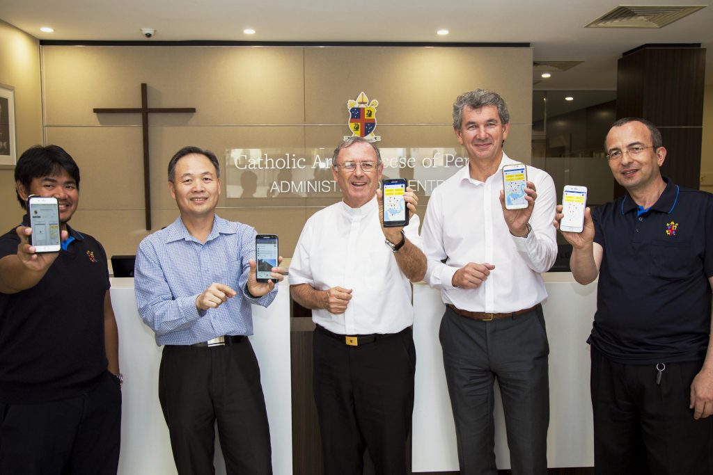 The Archdiocese of Perth has this week launched a new mobile app. Holding their phones are Vicar for Effective Communications the Most Rev Fr Peter Whitely VG, centre, with Archdiocesan CEO-Administration, Greg Russo (second from right) and Archdiocesan IT Manager, Loc Ha, (second from left), with IT Admin Support Officer, Jae Cabagyo (far left) and IT Web Support Officer, Vahdet Mert (far right). Photo: Josh Low