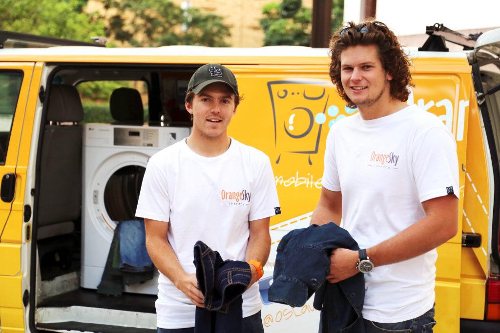 Lucas Patchett and Nic Marchesi were honoured in January for their work starting up a mobile laundry service – Orange Sky Laundry. The service provides a listening ear and a clean set of clothes to Australian women and men who are homeless. Photo: The Catholic Leader, Brisbane