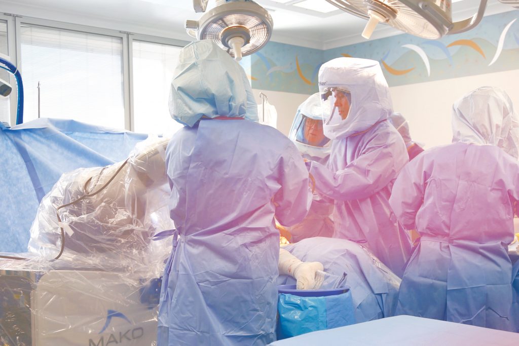 Robots are increasingly being used in operating rooms across Australia to assist surgeons with precise, intricate movements using smaller surgical instruments with smaller incisions. Photo: Supplied