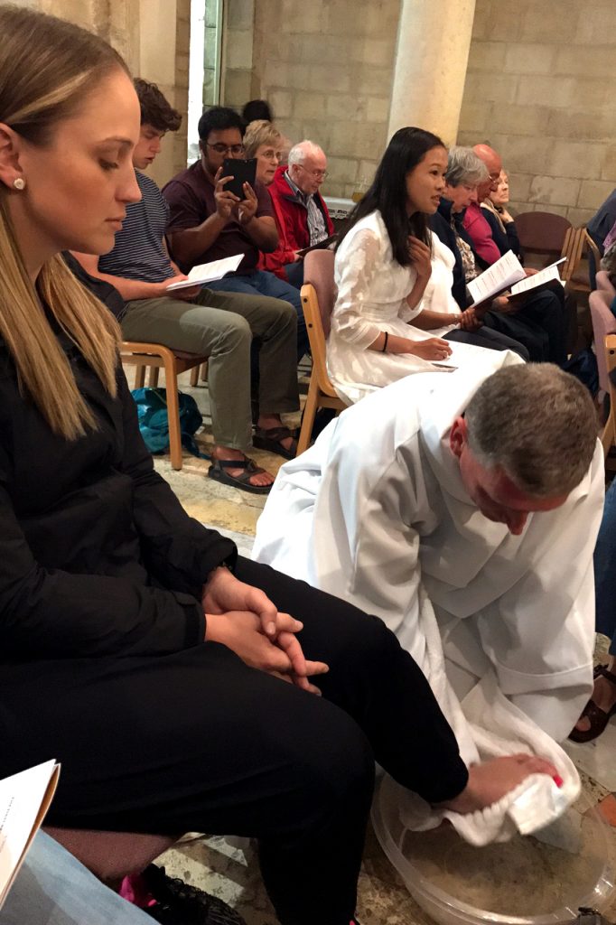 Tantur participant, Gemma Thomson, at the Washing of the Feet and Last Supper Mass at the Ecce Homo Convent in Jerusalem. Feet being washed by Tantur Ecumenical Institute Rector Fr Russ McDougall. Photo: Gemma Thompson