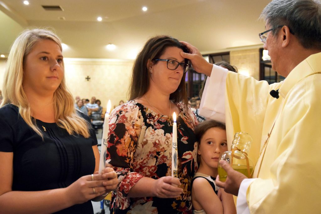 Lockridge Parish welcomed two catechumens and three candidates on the Vigil Mass on Holy Saturday. Photo: Supplied