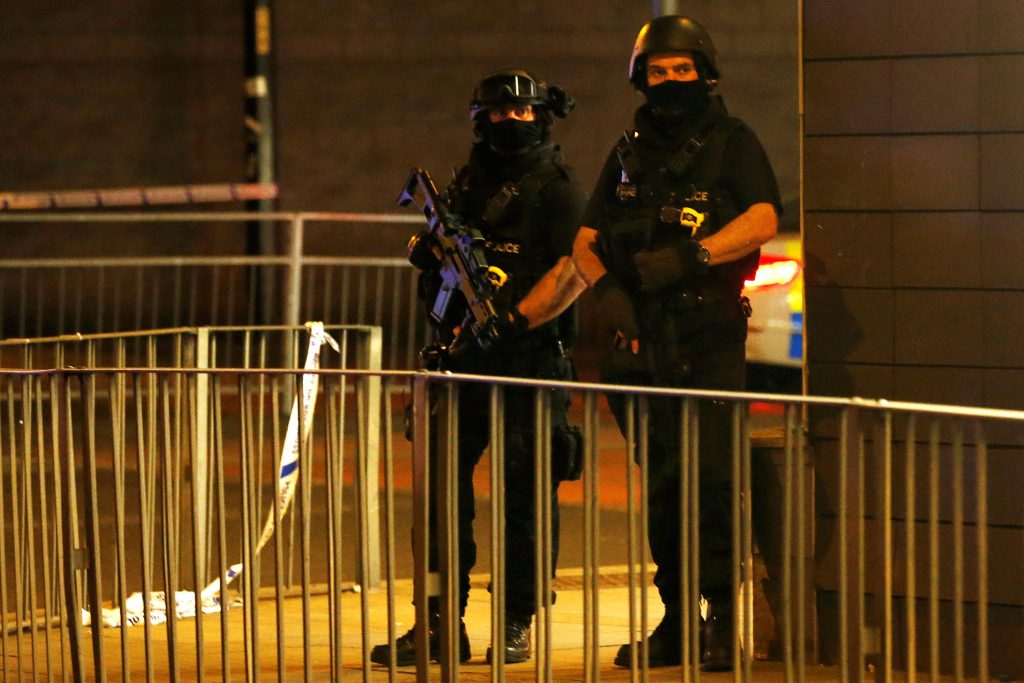 Armed police officers stand next to a barricade outside Manchester Arena in England where US singer Ariana Grande performed on 22 May. At least 22 people, including children, were killed and dozens wounded after an explosion at the concert venue. Authorities said it was Britain's deadliest case of terrorism since 2005. Photo: CNS/Andrew Yates.