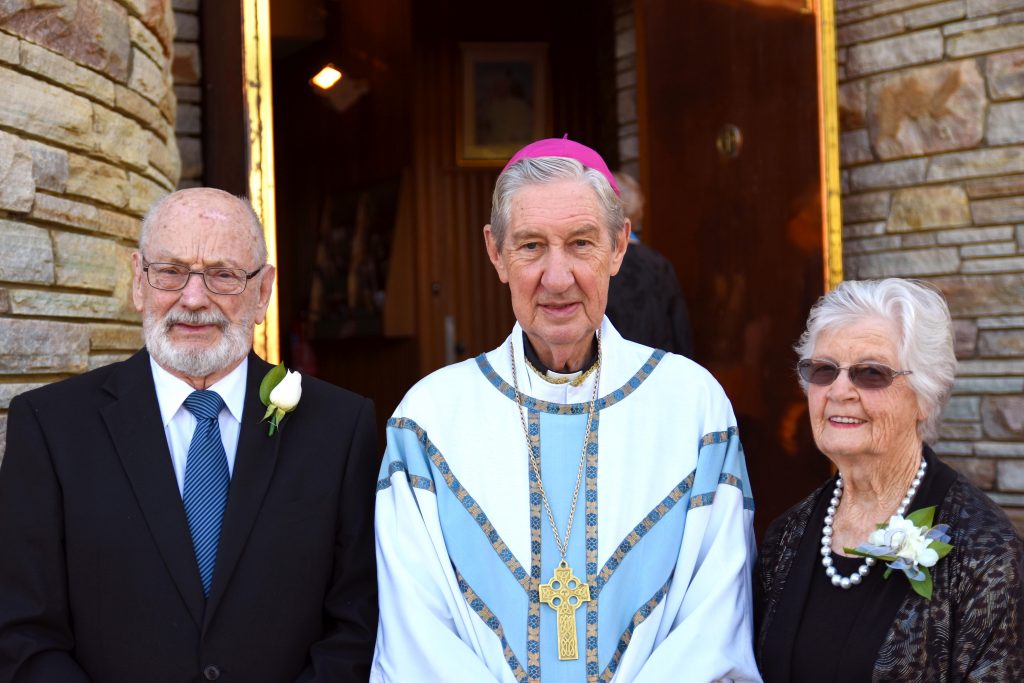 Mr and Mrs Peachey with Emeritus Archbishop Barry Hickey who celebrated their 60th anniversary Mass. Photo: Josh Low.