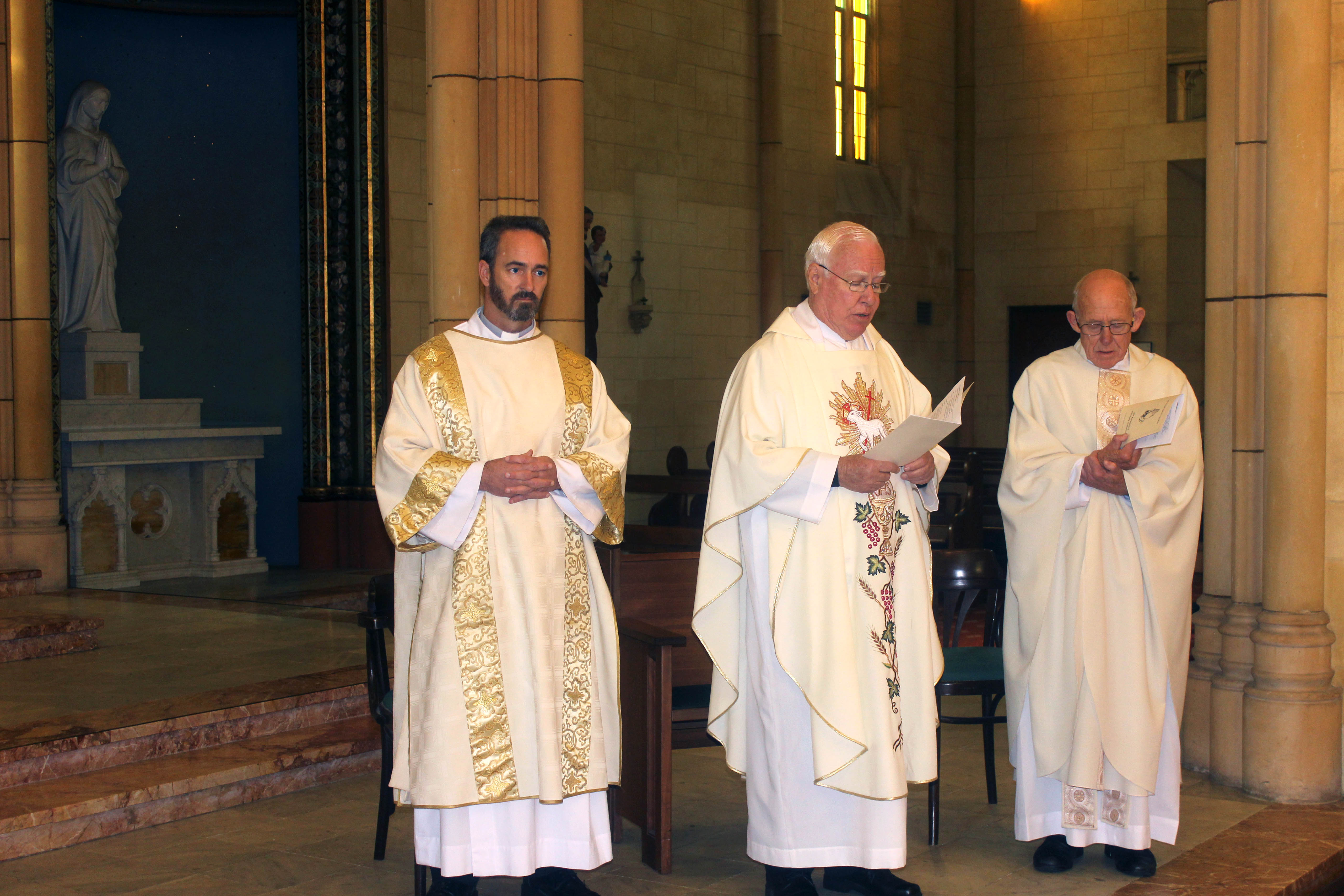 Fr Vincent Conroy with Fr Geoff Aldous and Deacon Aaron Peters at the anniversary Mass. Photo: Supplied.