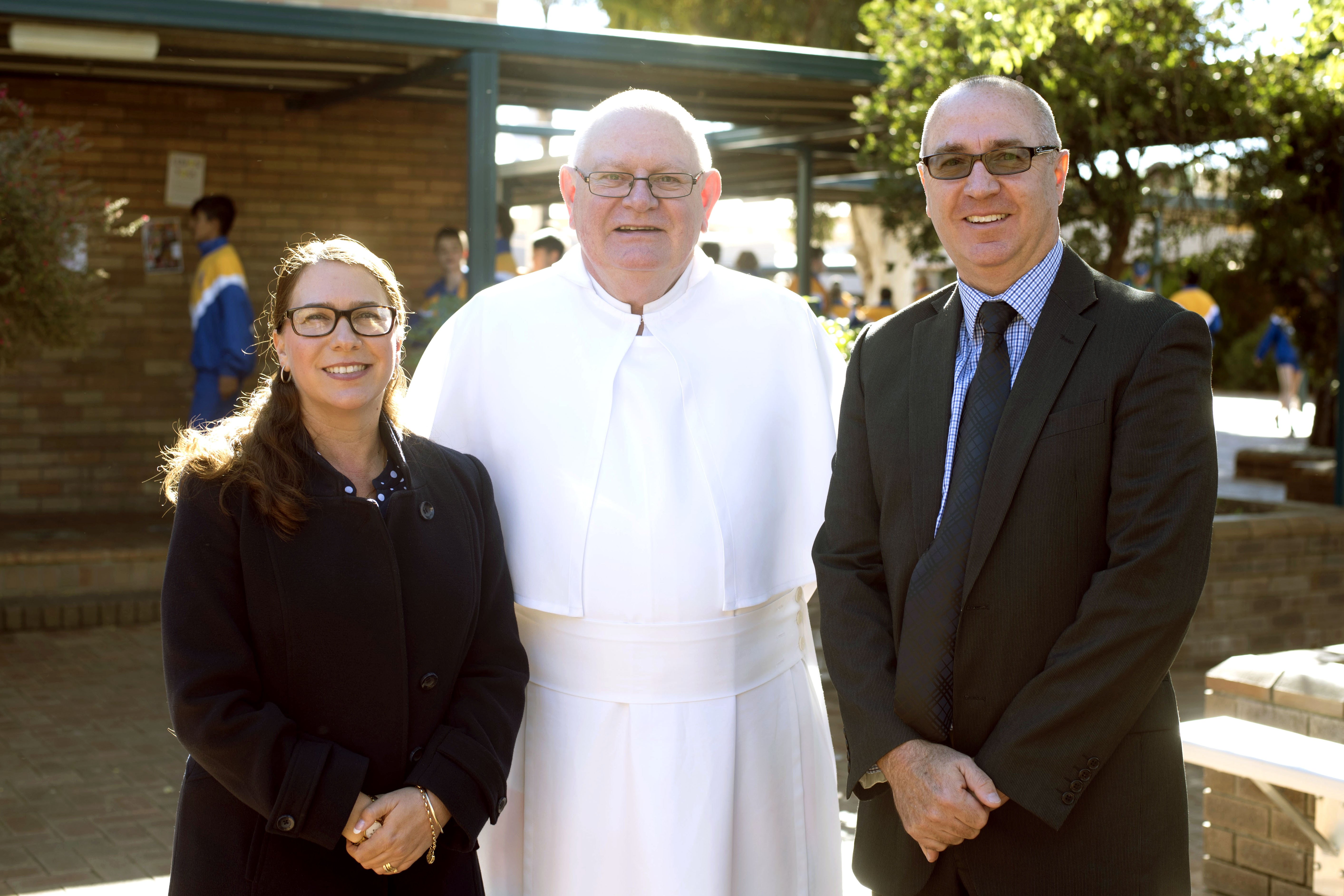 From left to right, departing Principal Annette Morey, Fr Peter Stiglich O Praem and new Principal Simon Harvey. Photo: Supplied.