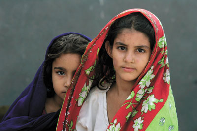 Siblings wait to return to their homes in Pakistan’s Swat Valley region from a bus terminal in Karachi.