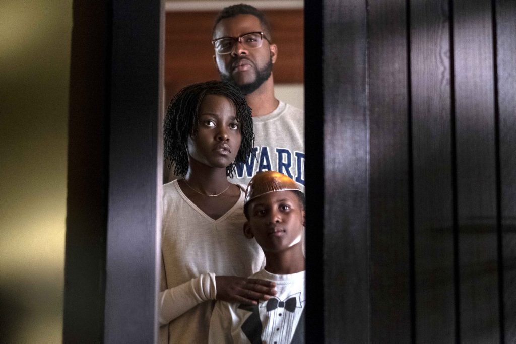 Winston Duke, back, Lupita Nyong'o and Evan Alex star in a scene from the movie "Us". Photo: Universal/CNS.