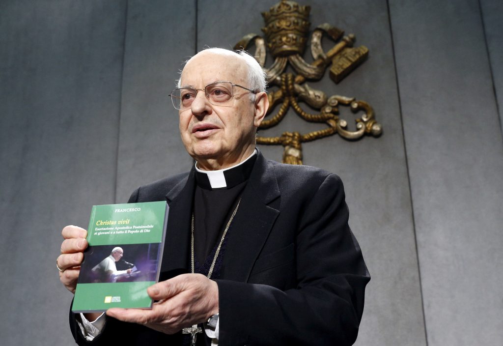 Cardinal Lorenzo Baldisseri, Secretary-General of the Synod of Bishops, holds Pope Francis' Apostolic Exhortation, “Christus Vivit" (Christ Lives), during a news conference for its presentation at the Vatican 2 April, 2019. The document contains the Pope's reflections on the 2018 Synod of Bishops on young people, the faith and vocational discernment. Photo: CNS/Paul Haring.