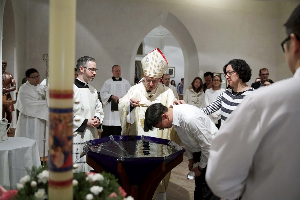 One of the 10 catechumens receiving the Sacrament of Baptism during the Easter Vigil Mass held at St Mary’s Cathedral on 20 April. Photo: Ron Tan.