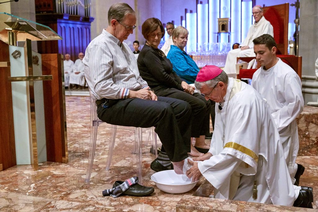 Archbishop Costelloe washes the feet of Cathedral Supervisor Tony Meyrick during the Mass for Holy Thursday at St Mary’s Cathedral on Thursday 19 April. Photo: Ron Tan.