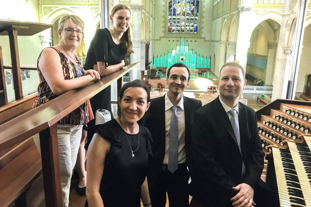 Johann Vexo and Damien Rivière, both Notre Dame musicians, stand with the St Mary’s Cathedral Director Jacinta Jakovcevic (front left) and choir members during their recent visit to Perth. Photo: Jacinta Jakovcevic.