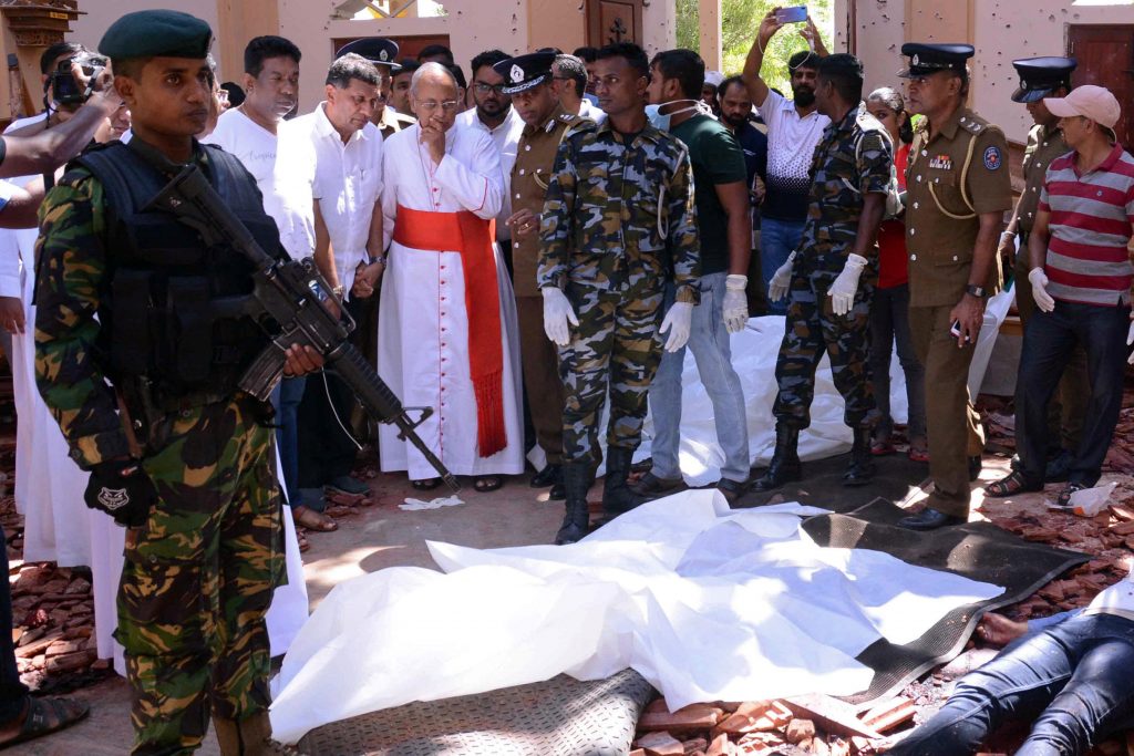 Cardinal Malcolm Ranjith of Colombo, Sri Lanka, looks at the explosion site inside a Church in Negombo on 21 April, following a string of suicide bomb attacks on churches and luxury hotels across the island. Photo: Reuters/CNS.