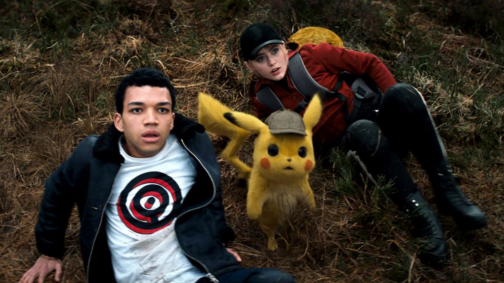 Justice Smith, Detective Pikachu (voiced by Ryan Reynolds), and Kathryn Newton appear in the movie "Pokemon Detective Pikachu". Photo: Warner Bros/CNS.