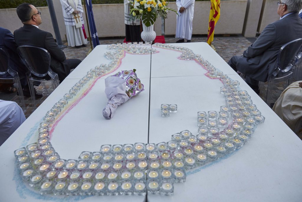 Candles were placed on a table to make the map of Sri Lanka during the interfaith service. Photo: Ron Tan.